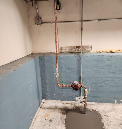 +Picture 9 of the new meter and transmitter in final position with interior restoration completed at 5008 W. Winnemac Ave